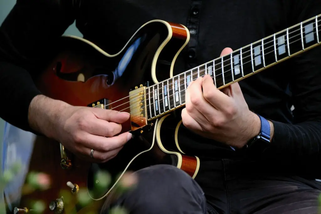 A man playing an electric guitar